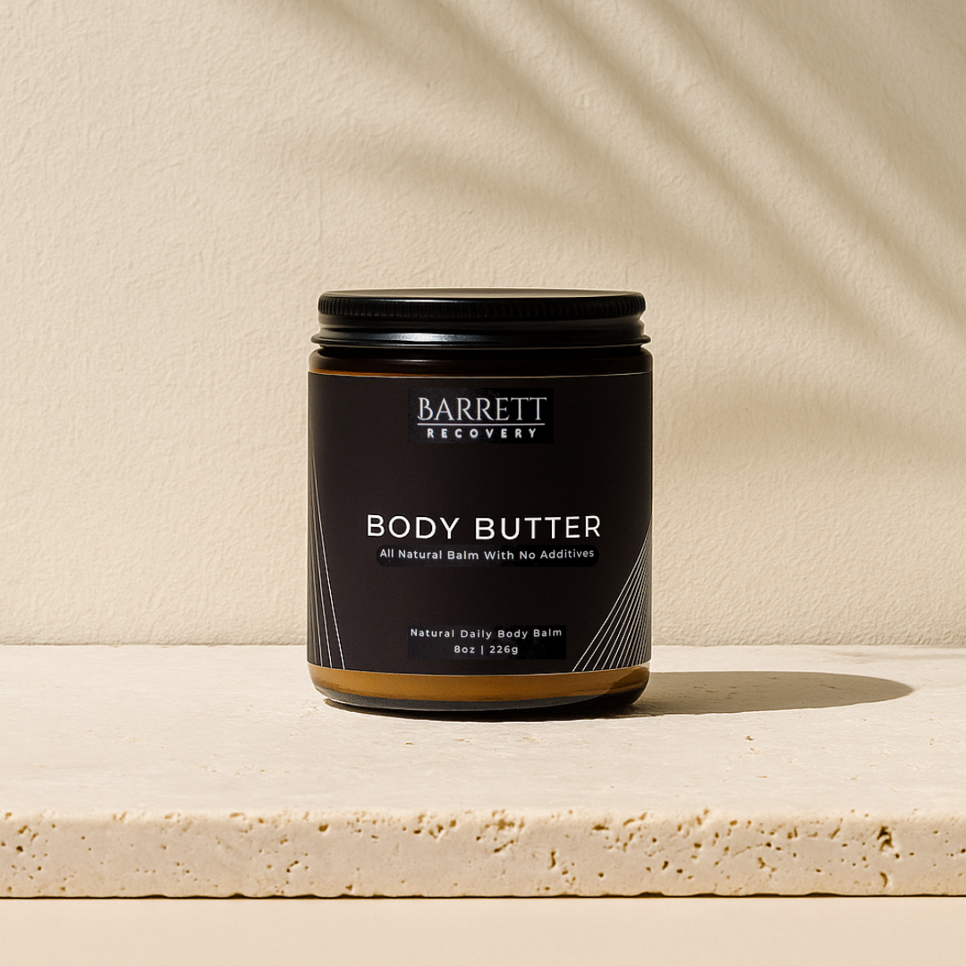 Jar of Barrett Recovery Body Butter on a beige background