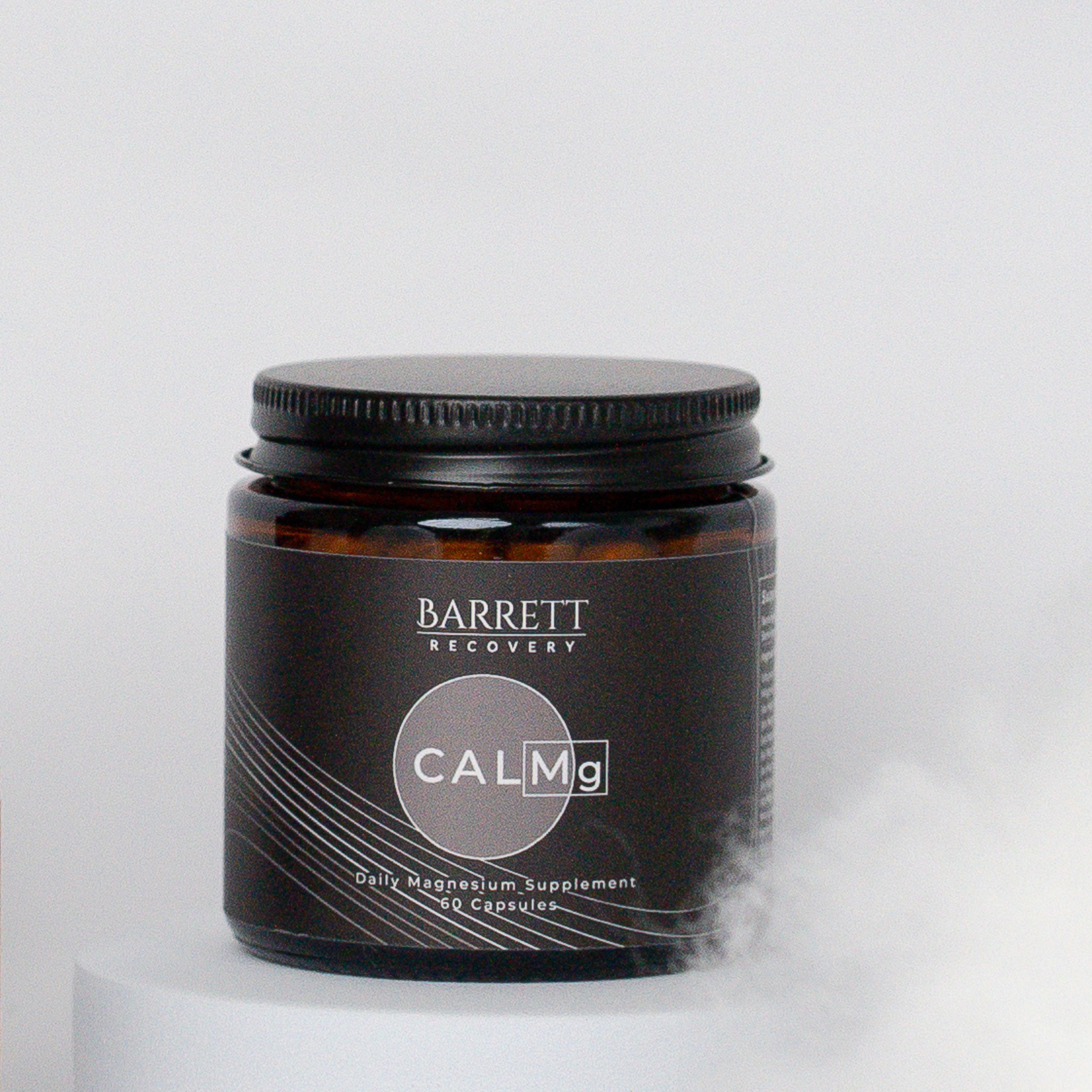 CALMG Magnesium supplement by barrett recovery in black glass jar