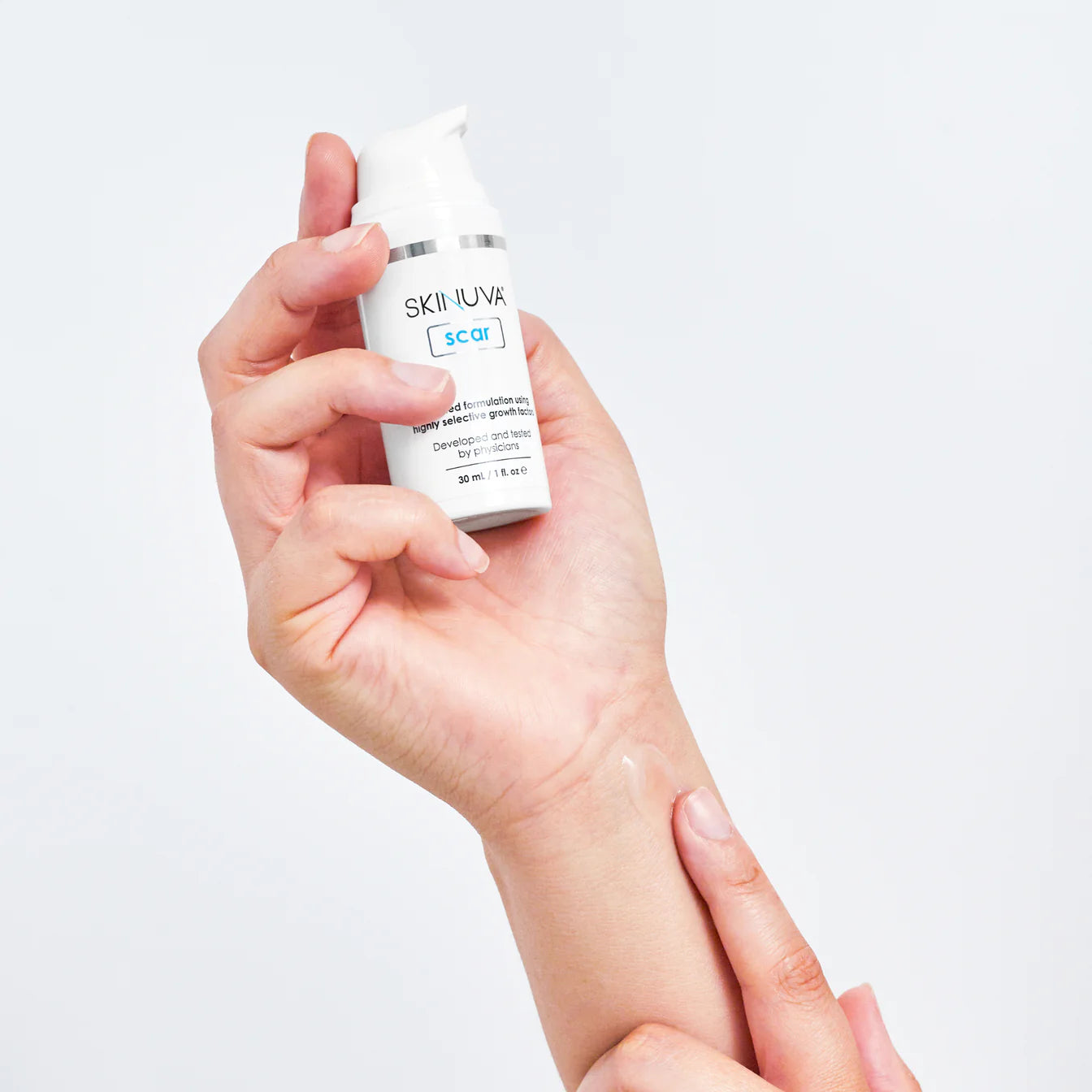 Skinuva Scar Gel 30mL in the palm of someone's hand