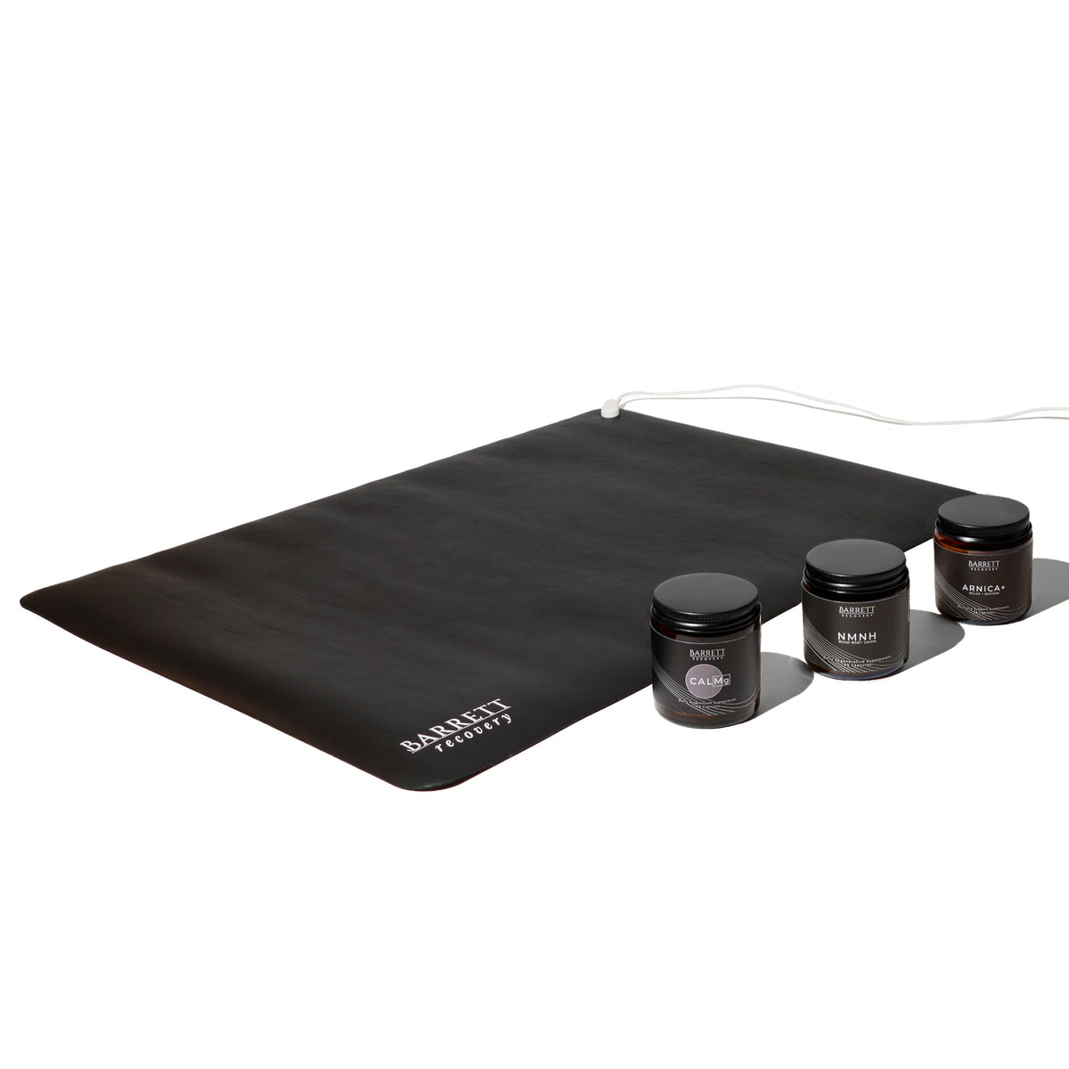 A collection of supplement bottles and a black grounding mat labeled 'Barrett Recovery'. This is an antiinflammation bundle