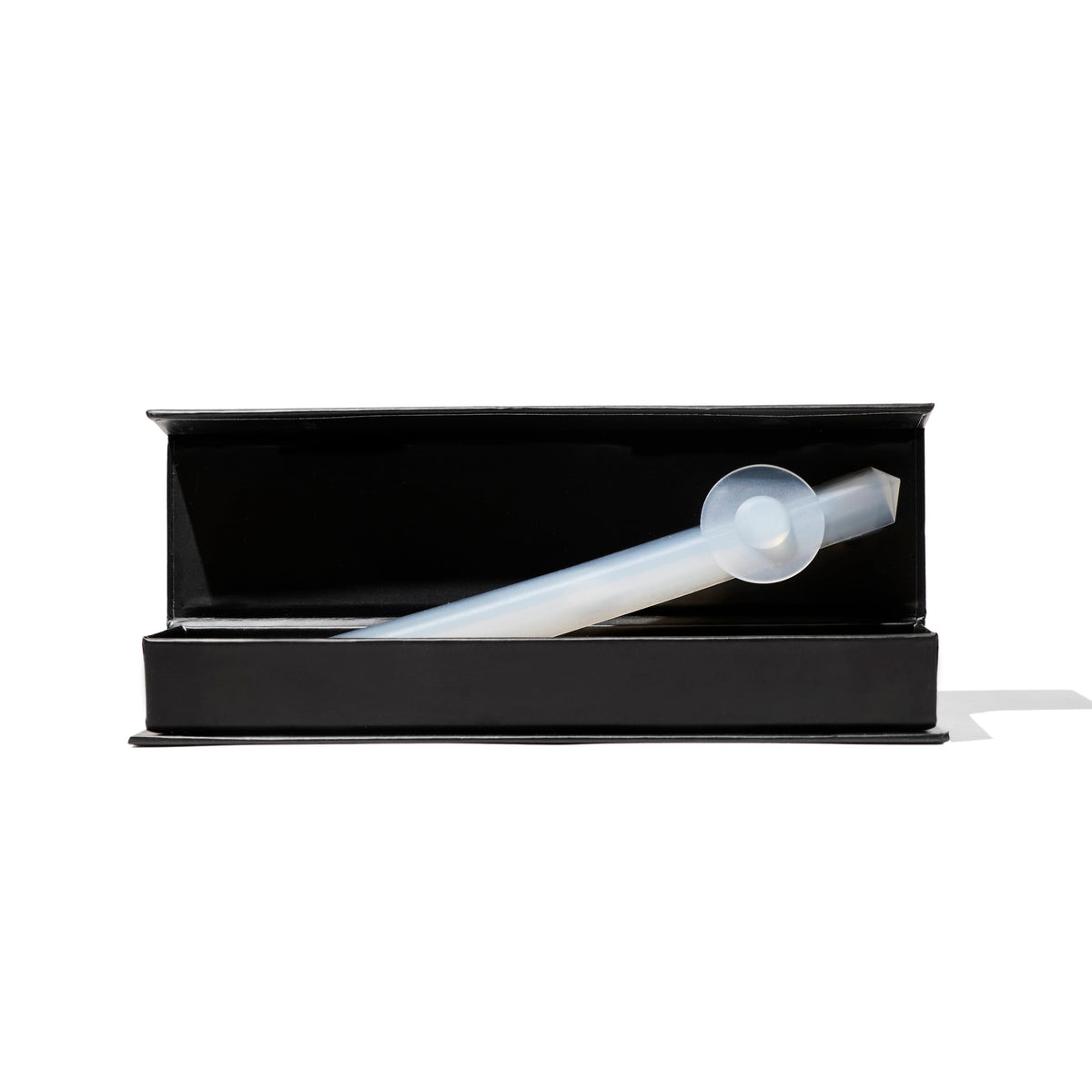 A black box with a white, cylindrical-shaped tool for belly button shaping, placed against a white background.