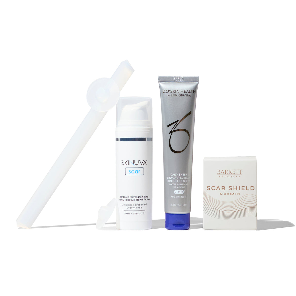 A collection of products for tummy tuck scar management including a scar sheet, scar gel, scar cream, and a bottle of lotion.