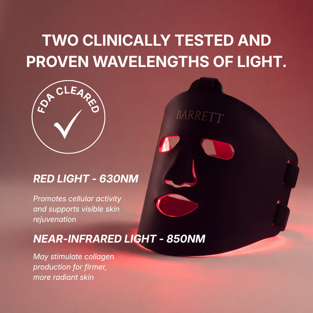 A black LED light therapy face mask with red glowing eye, nose, and mouth cutouts, shown on a dark red gradient background with marketing text about red and near-infrared wavelengths and an FDA cleared badge.