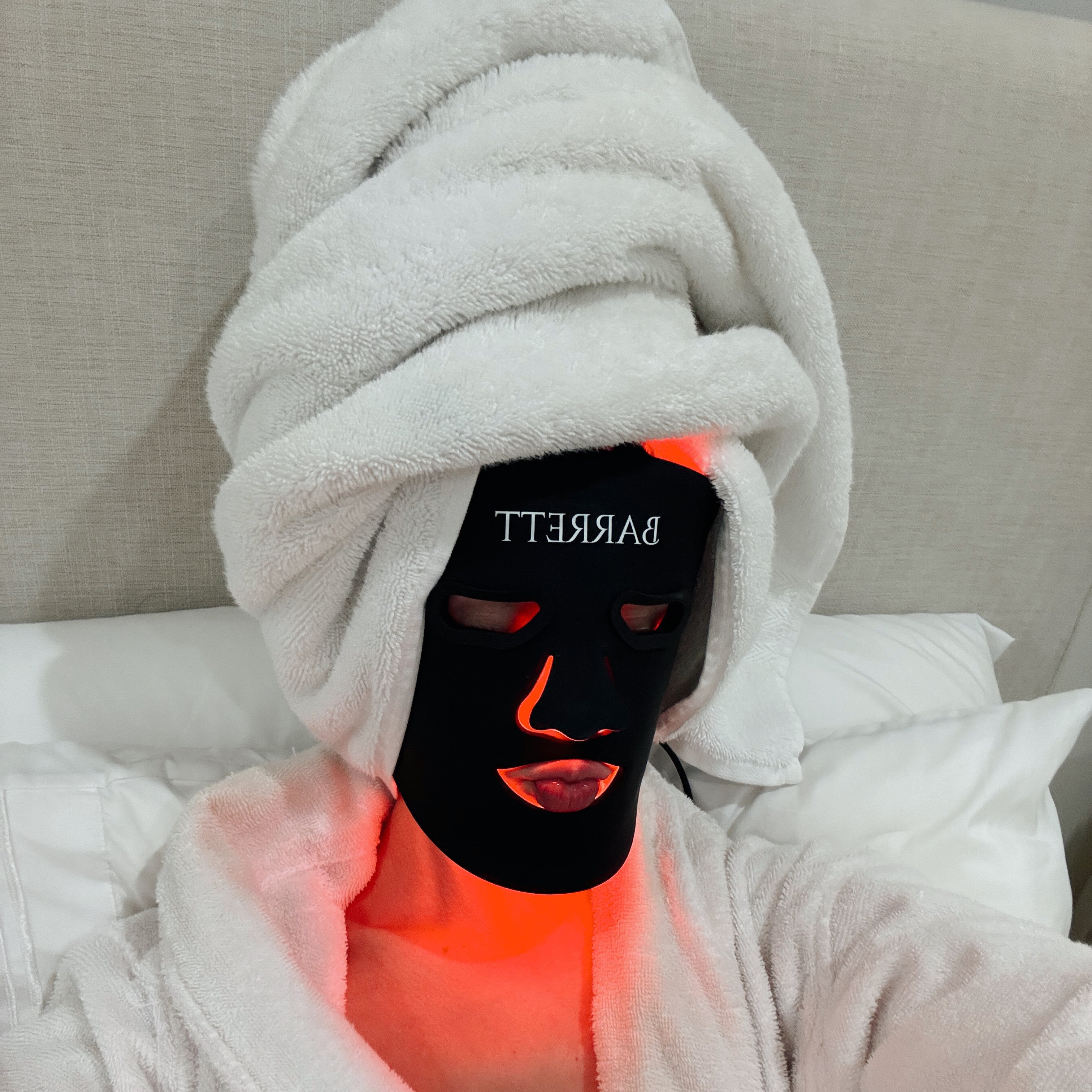 Woman wearing barrett recovery mask after shower