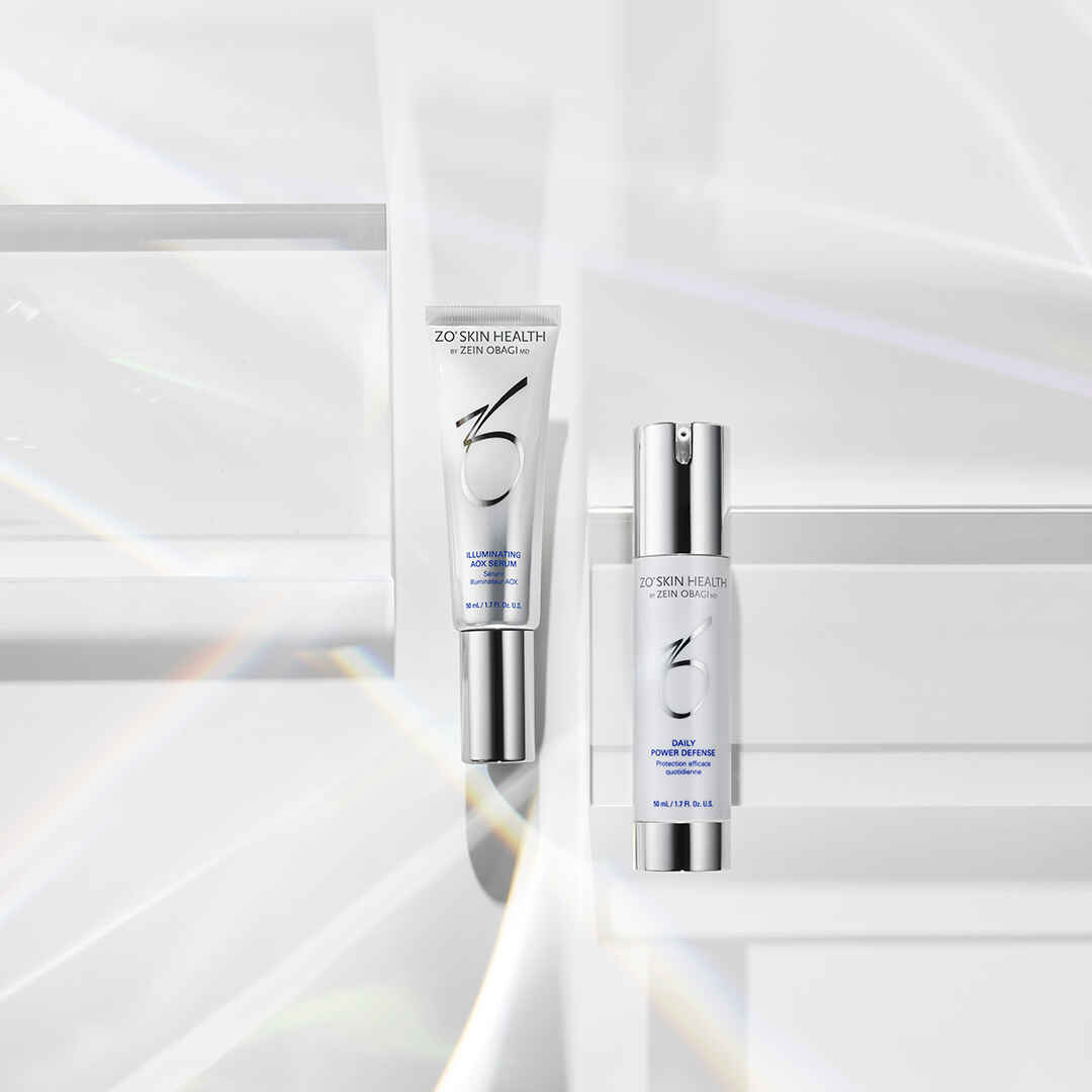 Daily Power Defense by Zein Obagi ZO Skin Health  next to illuminating AOX Serum 